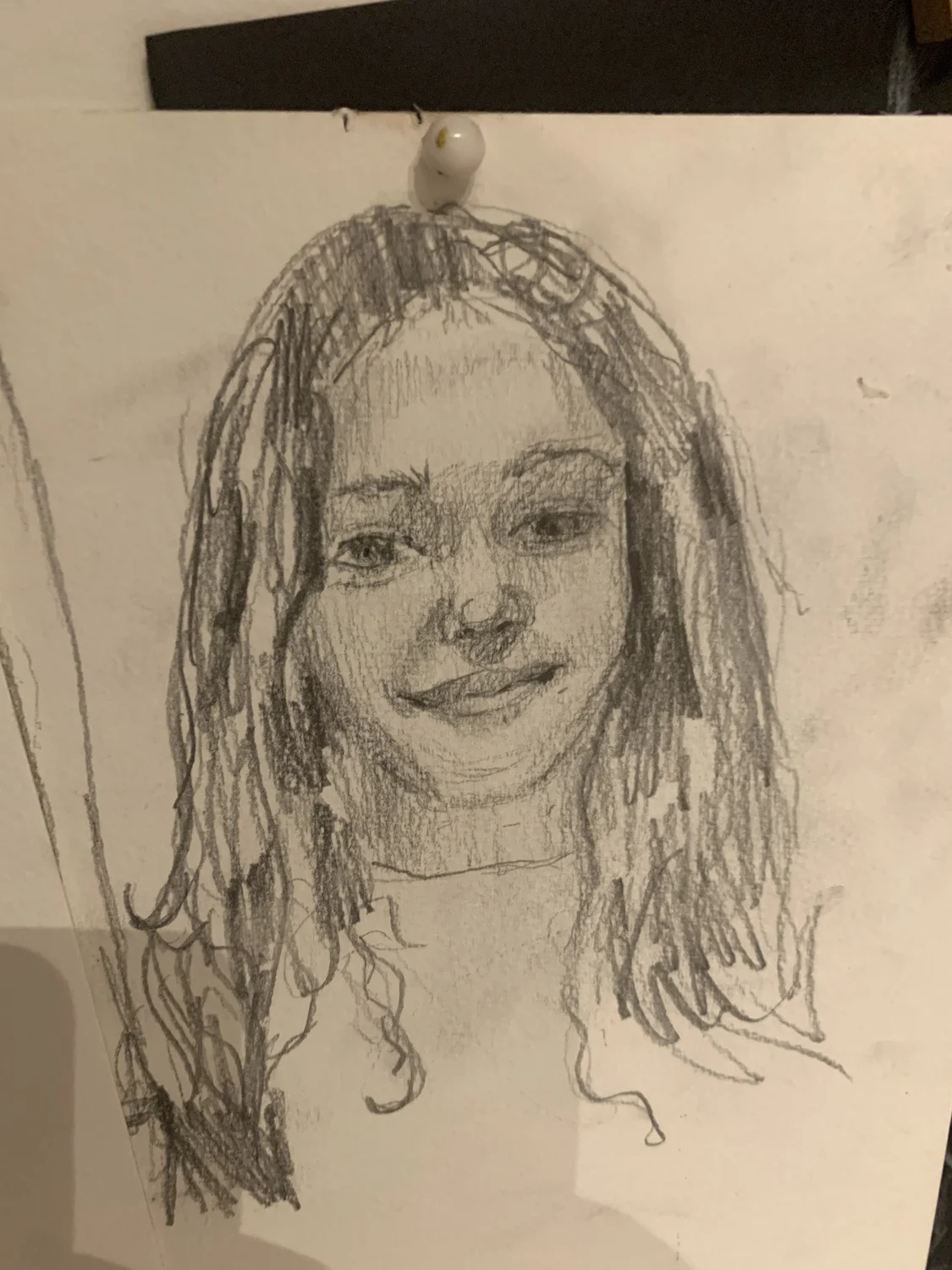 A pencil portrait of a person with long hair